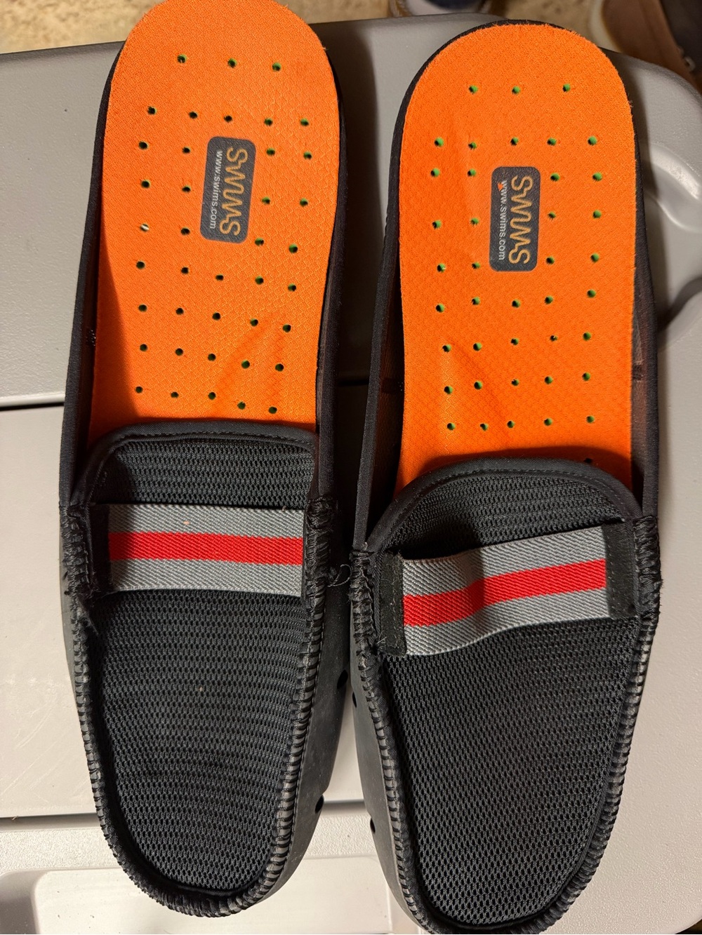 Swims Black Mesh Slip-On Loafers with Orange Insoles and Red Stripe